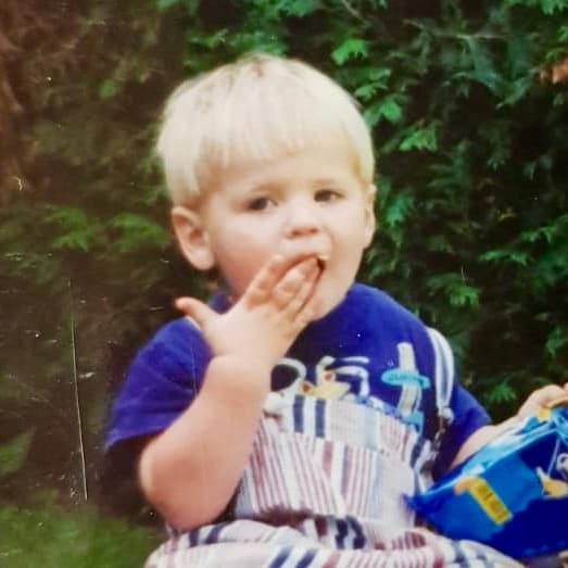 Photo of Alex as a baby eating