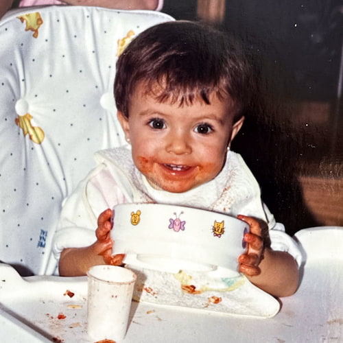 Photo of Maria as a baby eating
