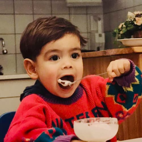 Photo of Robin as a baby eating