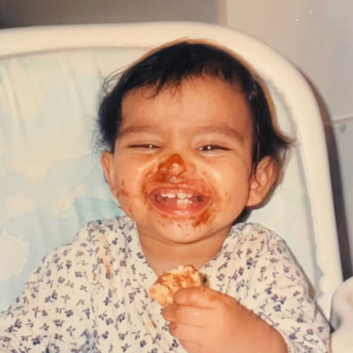 Photo of Sophia as a baby eating